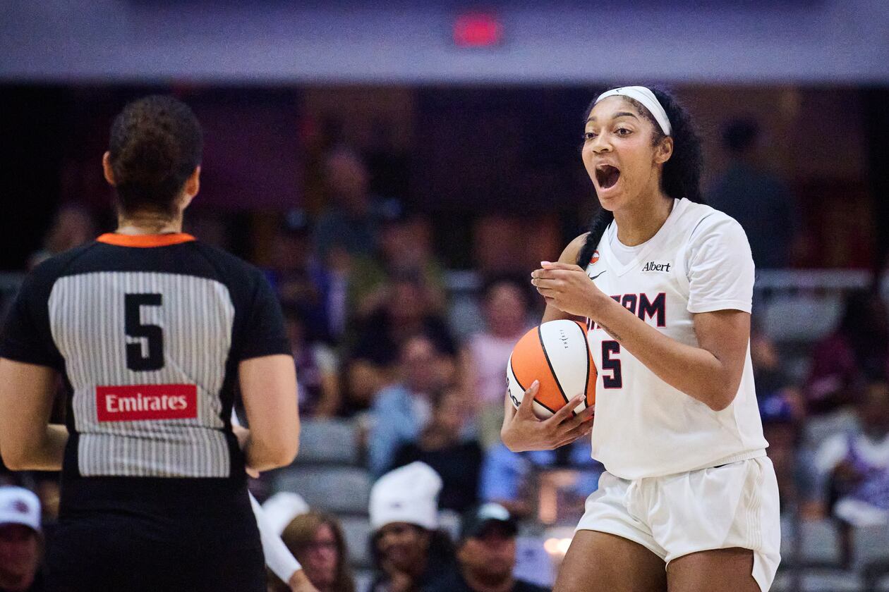 Dream All-Star Angel Reese, right, has 25 double-doubles this season, including Saturday's performance with 31 points and 14 rebounds. (Sammy Kogan/The Canadian Press via AP)