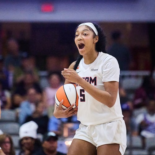 Dream All-Star Angel Reese, right, has 25 double-doubles this season, including Saturday's performance with 31 points and 14 rebounds. (Sammy Kogan/The Canadian Press via AP)
