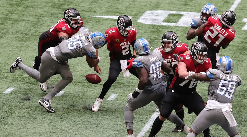 Detroit Lions defensive end Romeo Okwara (left) gets past Atlanta Falcons tackle Jake Matthews to strip sack quarterback Matt Ryan in the fourth quarter Sunday, Oct. 25, 2020, at Mercedes-Benz Stadium in Atlanta. The Lions recovered the ball, leading to a field goal to take a 16-14 lead. (Curtis Compton / Curtis.Compton@ajc.com)