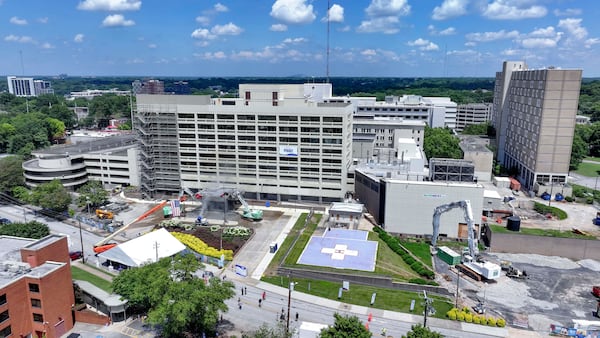 In this aerial image, heavy machinery is visible at the beginning of the demolition of the Atlanta Medical Center as the site undergoes its transformation into a new face of the developing project on Monday, June 30, 2025. The AMC served the surrounding communities for over a century. (Miguel Martinez/AJC)