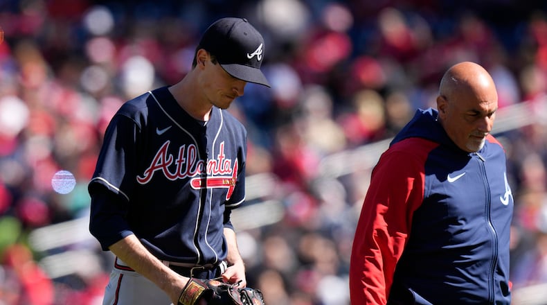 Atlanta Braves starting pitcher Max Fried, left, walks off the field during the fourth inning of an opening day baseball game against the Washington Nationals at Nationals Park, Thursday, March 30, 2023, in Washington. (AP Photo/Alex Brandon)