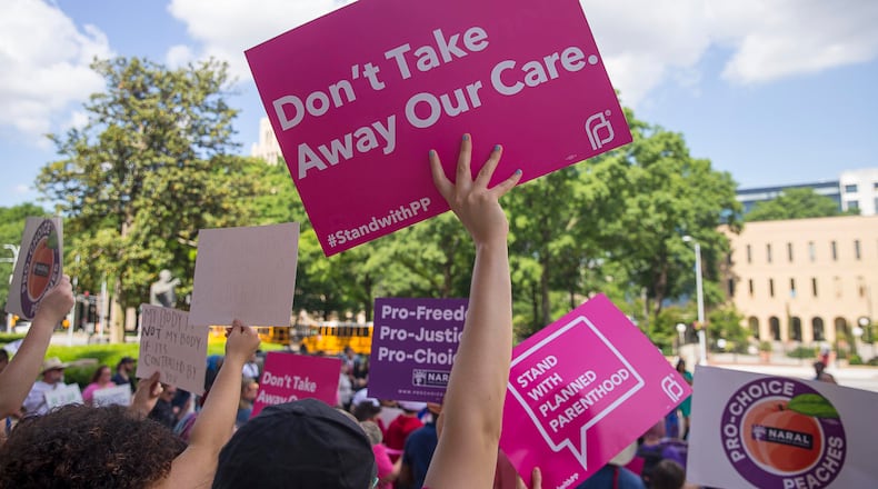 05/07/2019  -- Atlanta, Georgia -- Anti-Abortion protestors rally outside of the Georgia State Capitol building following the signing of HB 481 in Atlanta, Tuesday, May 7, 2019.  Georgia Governor Brian Kemp signed the bill, surrounded by supporters and Georgia lawmakers, in his office Tuesday morning.  (ALYSSA POINTER/ALYSSA.POINTER@AJC.COM)