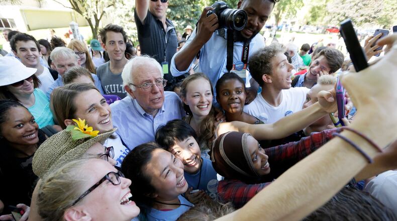 Democratic presidential candidate, Sen. Bernie Sanders, I-Vt., poses for a photo with supporters following a town hall meeting, Thursday, Sept. 3, 2015, in Grinnell, Iowa. (AP Photo/Charlie Neibergall)