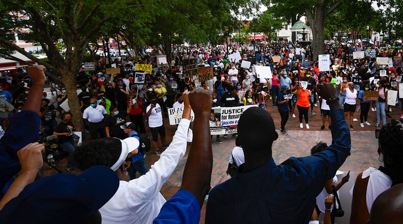 Protesters demonstrate on the square after making their way from the Cobb NAACP offices to Marietta Square during a demonstration to commemorate Juneteenth on Friday June 19, 2020, in Marietta. JOHN AMIS FOR THE ATLANTA JOURNAL-CONSTITUTION