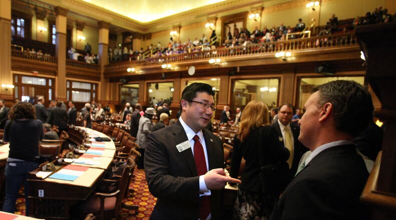 Then-state Rep. B.J. Pak, R-Lilburn, center, talks with Rep. Matt Ramsey, R-Peachtree City, before the start of the Georgia Legislature Session in 2012. Jason Getz jgetz@ajc.com