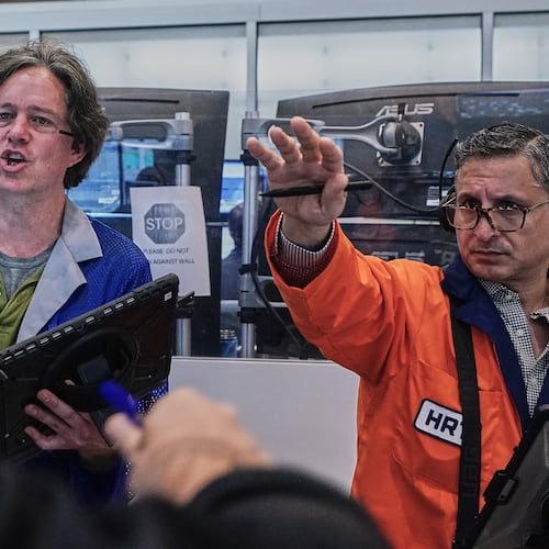 Options traders Justin Kanda, Doran Swan, and Ravi Bhandari. left to right, work on the floor of the New York Stock Exchange, Thursday, June 25, 2026. (AP Photo/Richard Drew)
