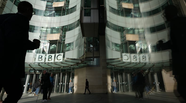 FILE - Pedestrians walk outside the BBC Headquarters in London, Wednesday, Nov. 12, 2025. (AP Photo/Kin Cheung, file)