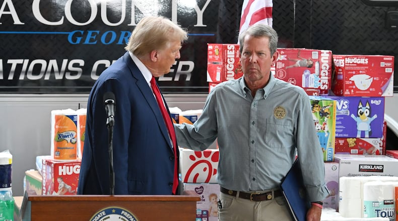 Then-former President Donald Trump and Gov. Brian Kemp greet each other during the press event at the Columbia Performing Arts Center on Friday, October 4, 2024, in Evans, Georgia. (Hyosub Shin / AJC)