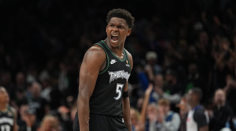 Minnesota Timberwolves guard Anthony Edwards (5) reacts after scoring against the San Antonio Spurs during the second half of Game 4 of an NBA basketball second-round playoffs series in Minneapolis, Sunday, May 10, 2026. (AP Photo/Abbie Parr)