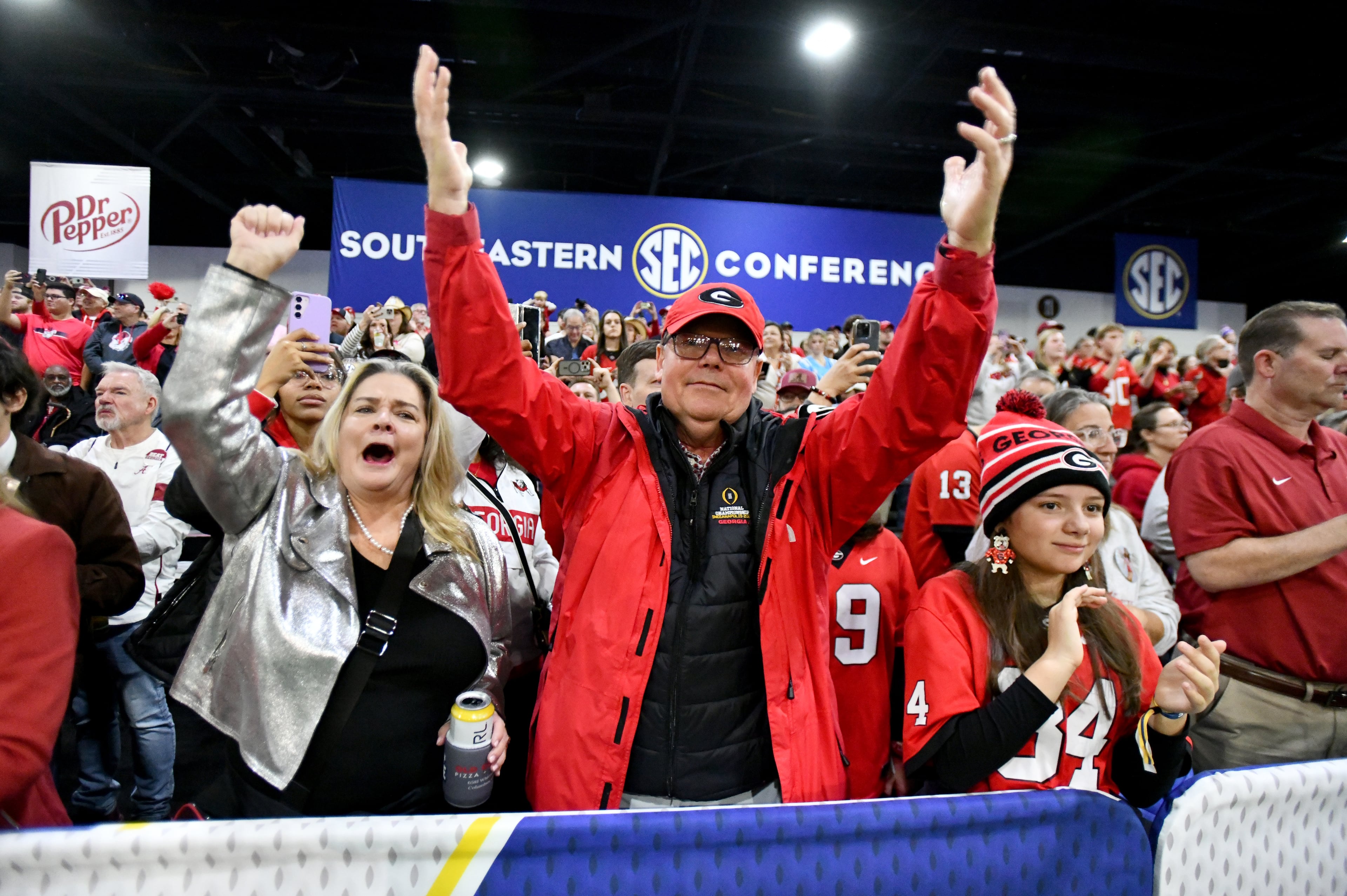 Georgia fans cheer during pep rallies at The Dr Pepper SEC FanFare ahead of the SEC Championship football game between Georgia and Alabama, Saturday, Dec. 6, 2025 in Atlanta. (Hyosub Shin/AJC)