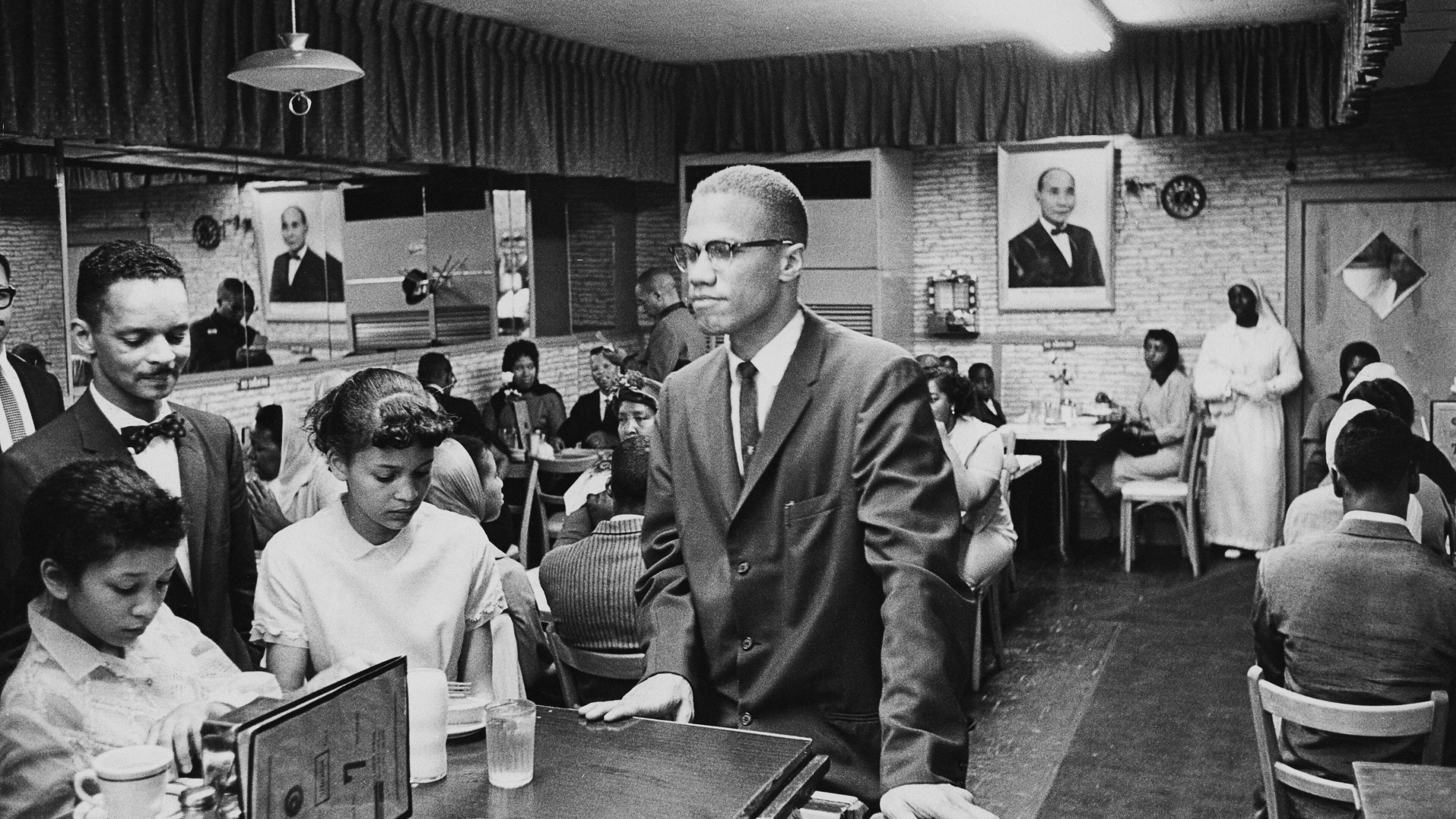 Malcolm X visited Temple 7, a Halal restaurant patronized by Black Muslims, while in Harlem, New York. (Photo by Richard Saunders/Pictorial Parade/Archive Photos/Getty Images)