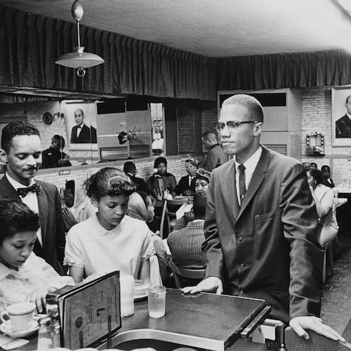 Malcolm X visited Temple 7, a Halal restaurant patronized by Black Muslims, while in Harlem, New York. (Photo by Richard Saunders/Pictorial Parade/Archive Photos/Getty Images)