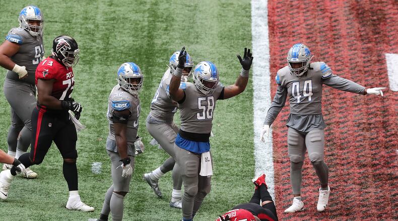 102520 Atlanta: Detroit Lions linebacker Jamie Collins signals touchdown as Falcons running back Todd Gurley trys to stop short of the endzone to control the final minutes of the clock in the fourth quarter of an NFL football game on Sunday, Oct 25, 2020 in Atlanta. Gurley broke the plane for a touchdown for a 20-16 lead and the Falcons added the 2-point conversion to extend the lead to 22-16 but left enough time on the clock for the Lions to come back for the game winning touchdown and extra point to beat the Falcons 23-22 as time expired. “Curtis Compton / Curtis.Compton@ajc.com”