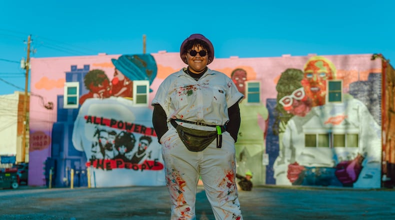 The artist known as SOFAHOOD standing in front of the mural created as part of the Adult Swim Atlanta Mural Project.
Courtesy of Brock Scott