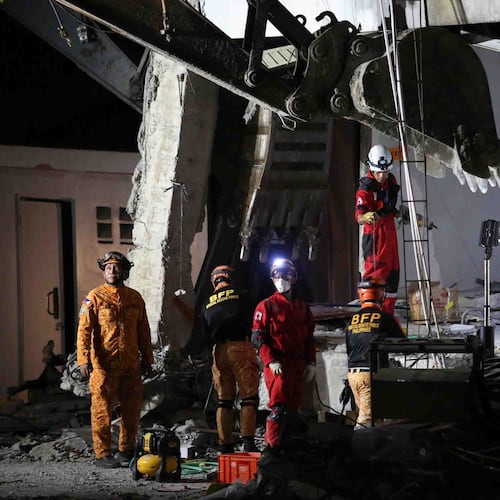 Rescuers use heavy equipment as they conduct a search and retrieval operation at a damaged building following an earthquake in General Santos, Philippines, Tuesday, June 9, 2026. (AP Photo/Basilio Sepe)