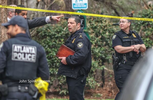 Police are investigating after an off-duty officer shot at a man attempting to break into his apartment in northwest Atlanta, authorities said. 