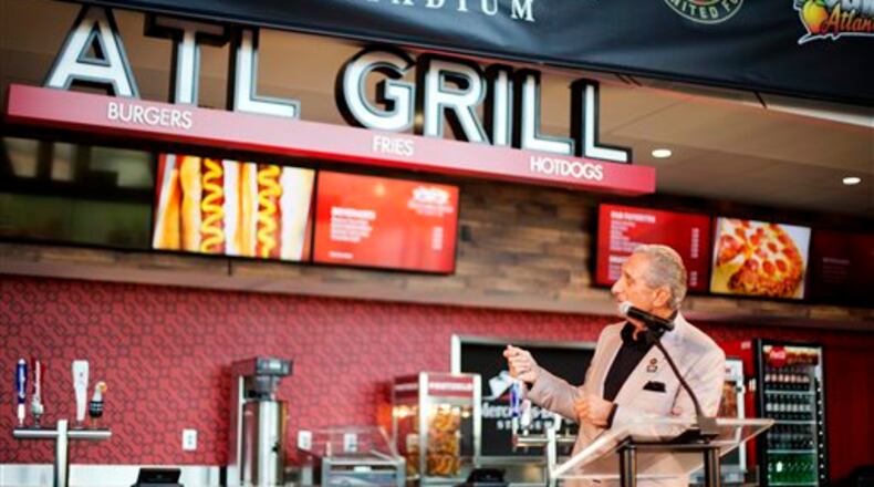 Atlanta Falcons owner Arthur Blank speaks during a news conference inside the team's new stadium currently under construction Monday, May 16, 2016, in Atlanta. Blank says the Mercedes-Benz Stadium is on schedule to open in June, 2017 as scheduled and he's hoping it will be announced next week as the site of a Super Bowl. The Falcons also unveiled their new food and beverage plan which includes $2 hot dogs and soft drinks, a sharp decrease from current prices at the Georgia Dome. (AP Photo/David Goldman)