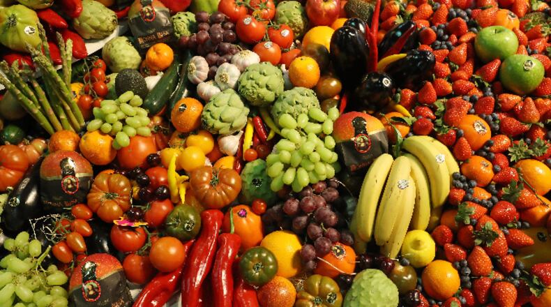 Fresh fruits and vegetables lie on display.