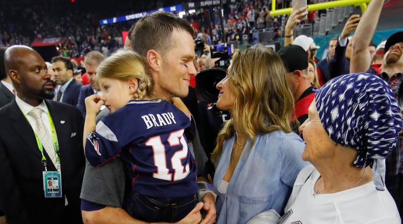 HOUSTON, TX - FEBRUARY 05: Tom Brady #12 of the New England Patriots celebrates with wife Gisele Bundchen and daughter Vivian Brady after defeating the Atlanta Falcons during Super Bowl 51 at NRG Stadium on February 5, 2017 in Houston, Texas. The Patriots defeated the Falcons 34-28. (Photo by Kevin C. Cox/Getty Images)