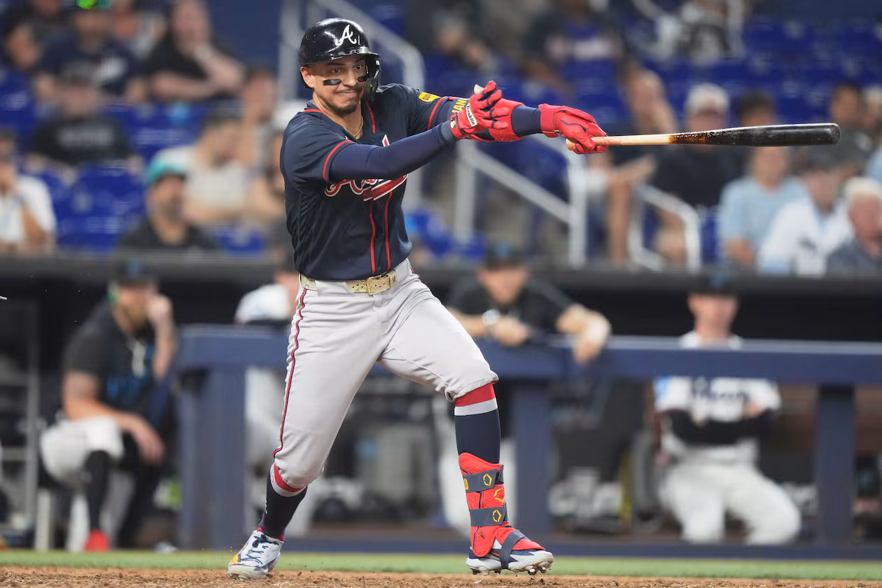 Atlanta Braves' Mauricio Dubón hits a RBI single to score Mike Yastrzemski during the eighth inning of a baseball game against the Miami Marlins, Tuesday, May 19, 2026, in Miami. (AP Photo/Lynne Sladky)