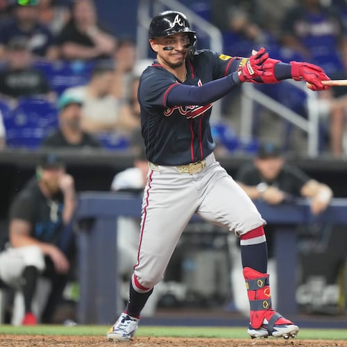 Atlanta Braves' Mauricio Dubón hits a RBI single to score Mike Yastrzemski during the eighth inning of a baseball game against the Miami Marlins, Tuesday, May 19, 2026, in Miami. (AP Photo/Lynne Sladky)