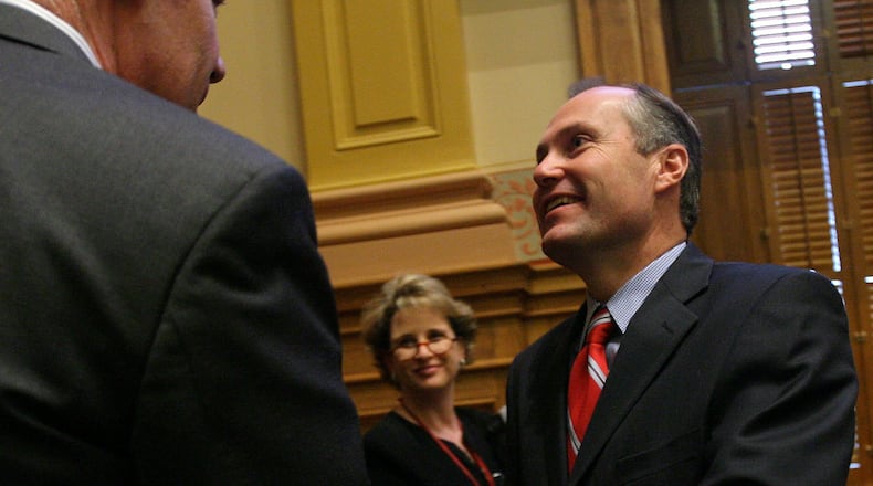 February 2, 2007, ATLANTA -- Sen. Dan Weber, R-Dunwoody, (left) and Lt. Gov. Casey Cagle shake hands after Cagle's charter school system bill, which Weber carried in the Senate, passed the chamber. BEN GRAY / AJC STAFF