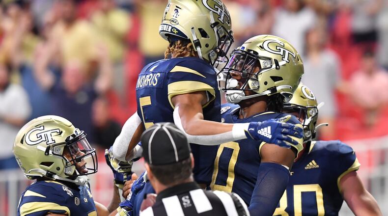 Georgia Tech quarterback Jeff Sims (10) celebrates with teammates after scoring a touchdown during the first half against North Carolina Saturday, Sept. 25, 2021, at Mercedes-Benz Stadium in Atlanta. (Hyosub Shin / Hyosub.Shin@ajc.com)
