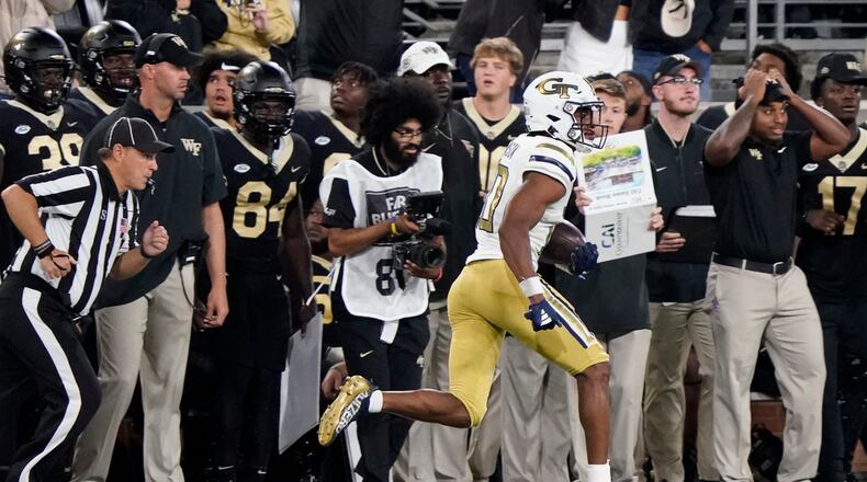 Georgia Tech defensive back Kenan Johnson runs after intercepting a Wake Forest pass during the second half of an NCAA college football game in Winston-Salem, N.C., Saturday, Sept. 23, 2023. (AP Photo/Chuck Burton)