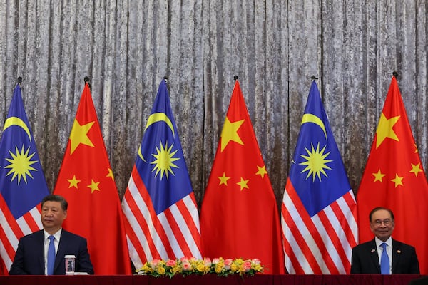 Chinese President Xi Jinping, left, and Malaysiass Prime Minister Anwar Ibrahim look on before the witnessing Exchange of Agreement session at the official residence of the Malaysian prime minister in Putrajaya, outside Kuala Lumpur, Malaysia, Wednesday April 16, 2025. (Fazry Ismail/Pool Photo via AP)