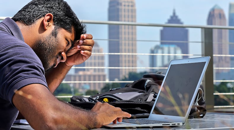 Girish Mururu, 23, a first year masters student in computer science ponders his school work at the G. Wayne Clough Undergraduate Learning Center at Georgia Tech.