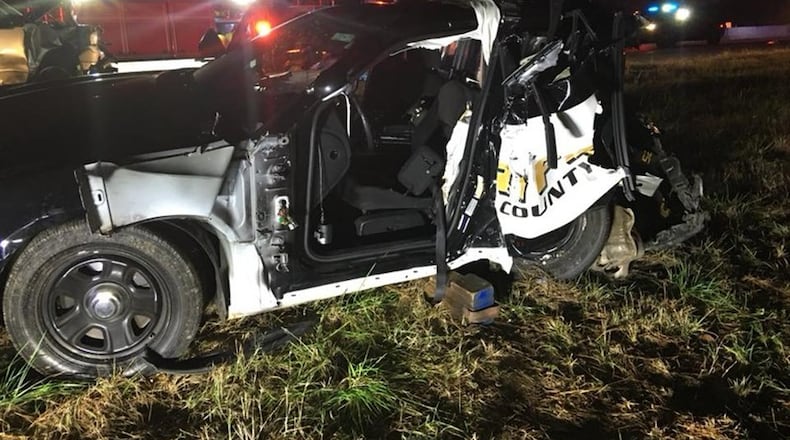 A Forsyth County Sheriff’s Office deputy was injured in 2017 when a vehicle driven by a motorist suspected of driving under the influence crashed into his parked patrol car on Ga. 400. (Photo: Forsyth County Sheriff’s Office)
