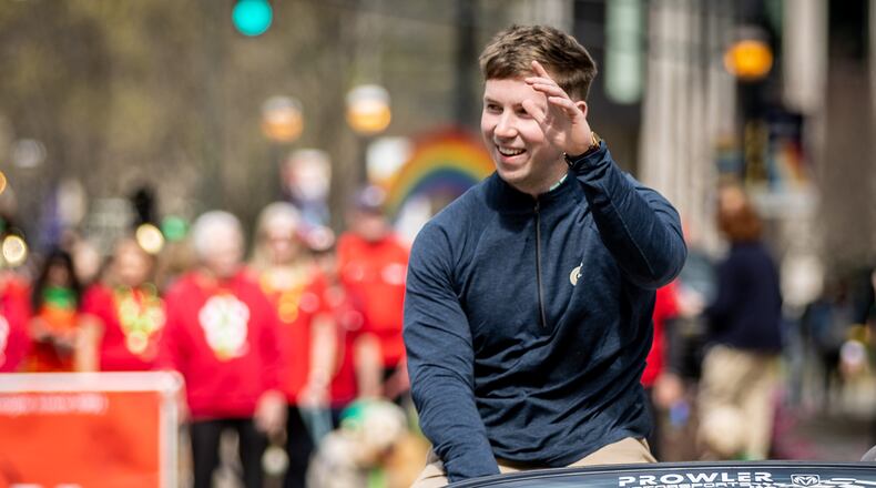 Grand marshal and Georgia Tech football player David Shanahan waves to the crowd during Atlanta's St. Patrick's Parade on Saturday, March 11, 2023. Shanahan is from Castleisland, County Kerry, Ireland. (Photo: Steve Schaefer / steve.schaefer@ajc.com)