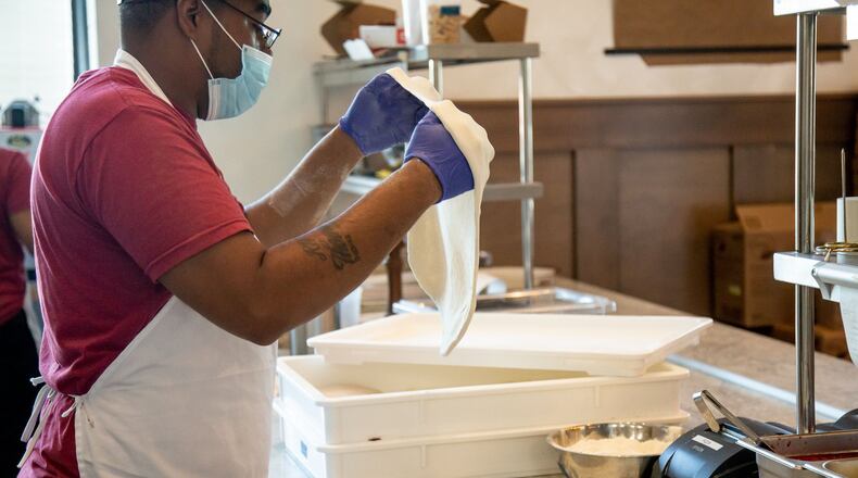 Deshayne Edmondson works on a pizza at the Grana restaurant in Atlanta, Friday 12, 2020. PHOTO: STEVE SCHAEFER FOR THE ATLANTA JOURNAL-CONSTITUTION