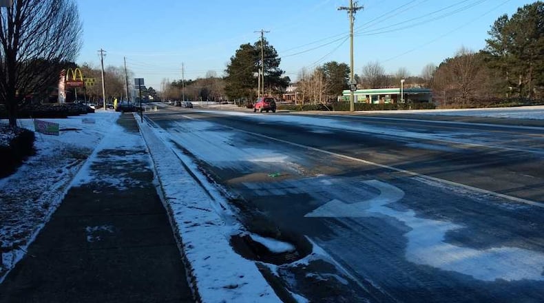 Ice was visible on Arnold Mill Road eastbound in the right and left turn lanes approaching Crabapple Road shortly before 5 p.m. Wednesday.