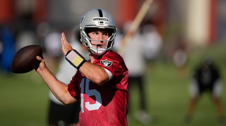 FILE - Las Vegas Raiders quarterback Fernando Mendoza throws during the NFL football team's practice Wednesday, June 10, 2026, in Henderson, Nev. (AP Photo/John Locher)