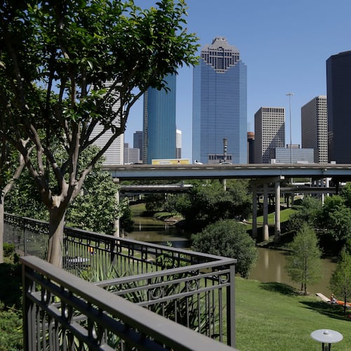 FILE - The Houston skyline overlooks the Buffalo Bayou as it snakes its' way into downtown April 18, 2014. (AP Photo/Pat Sullivan, File)