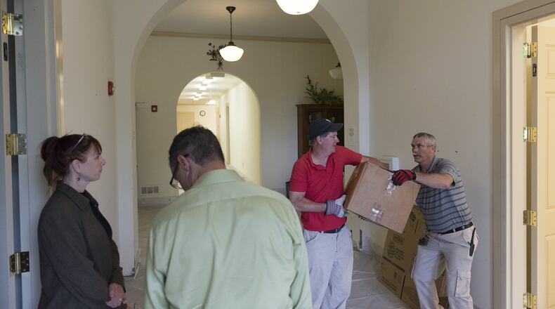 From left, Melissa Forgey, executive director of the DeKalb History Center, John Cerniglia, vice president of development at The United Methodist Children’s Home, Tom Tuttle, a facilities technician with the home, and Dorsey Nobles, its facilities supervisor, in Decatur, on Thursday, April 27, 2017. T Nobles was a resident of the Home since November, 1971. (DAVID BARNES / DAVID.BARNES@AJC.COM)