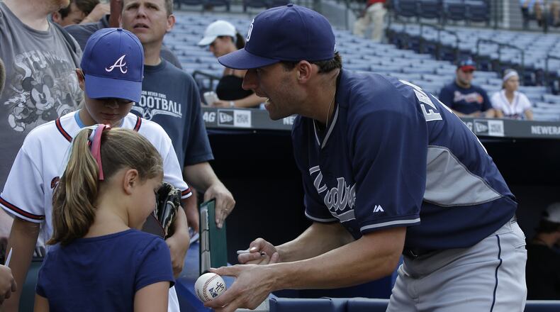 ATLANTA, GA - JULY 25: San Diego Padres right fielder, and former Atlanta Braves outfielder, Jeff Francoeur #17 signs autographs for fans before the game between the Atlanta Braves and the San Diego Padres at Turner Field on July 25, 2014 in Atlanta, Georgia. (Photo by Mike Zarrilli/Getty Images)