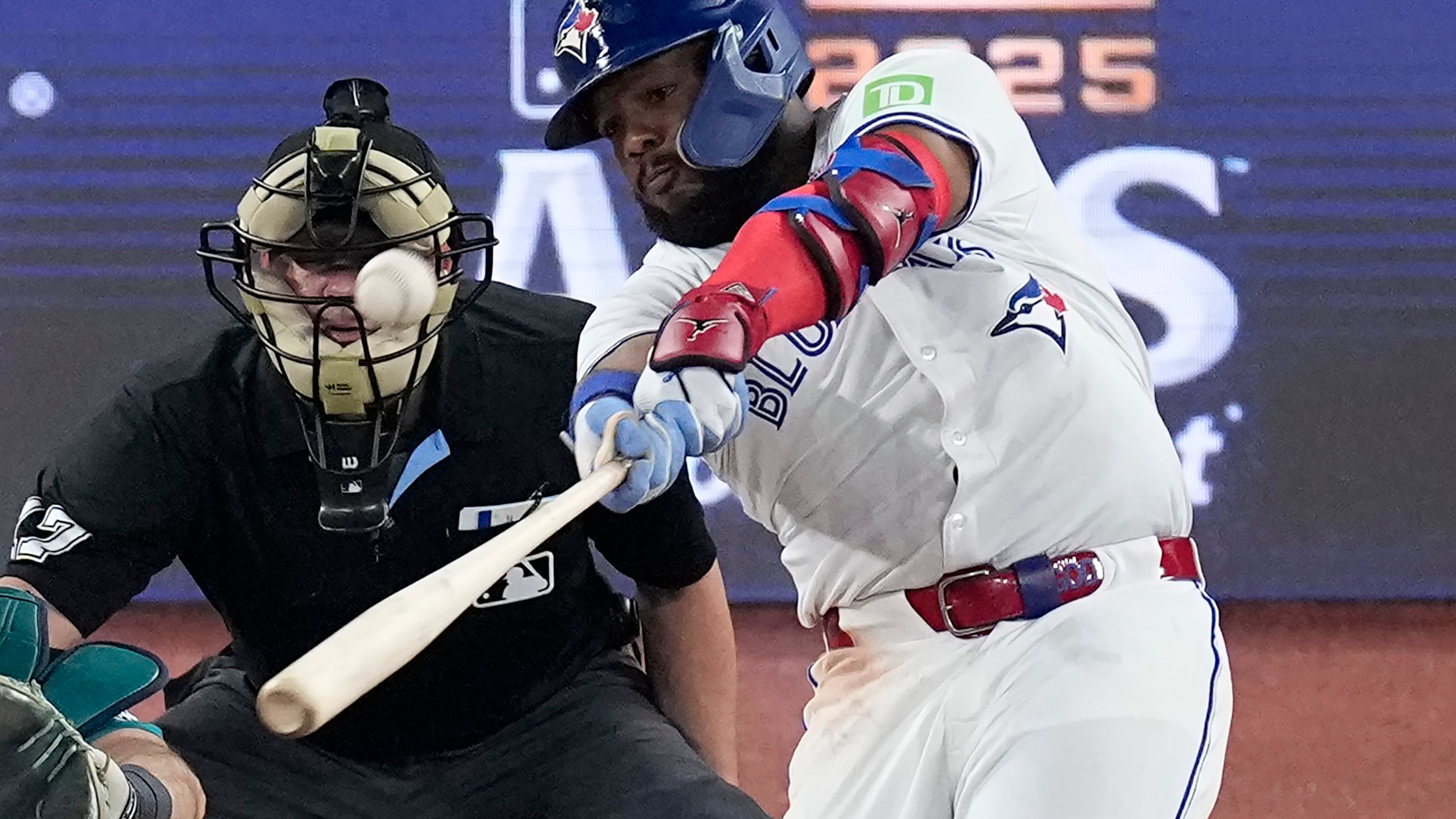 Toronto Blue Jays' Vladimir Guerrero Jr. connects for a solo home run against the Seattle Mariners during the fifth inning in Game 6 of baseball's American League Championship Series, Sunday, Oct. 19, 2025, in Toronto. (AP Photo/David J. Phillip)