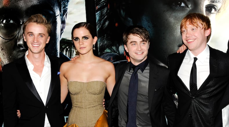 FILE - In this July 11, 2011 file photo, cast members, from left, Tom Felton, Emma Watson, Daniel Radcliffe and Rupert Grint pose together at the premiere of "Harry Potter and the Deathly Hallows: Part 2" at Avery Fisher Hall in New York. Warner Bros. said on Oct. 3, 2016, that all 8 Harry Potter films will be re-released in theaters for a one-week run beginning Oct. 13, 2016. (AP Photo/Evan Agostini, File)