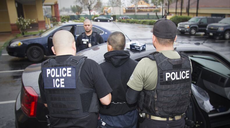 In this Tuesday, Feb. 7, 2017, photo released by U.S. Immigration and Customs Enforcement, foreign nationals are arrested in Los Angeles. President Donald Trump wants local law enforcement to play a larger role in immigration enforcement. Charles Reed/U.S. Immigration and Customs Enforcement via AP)