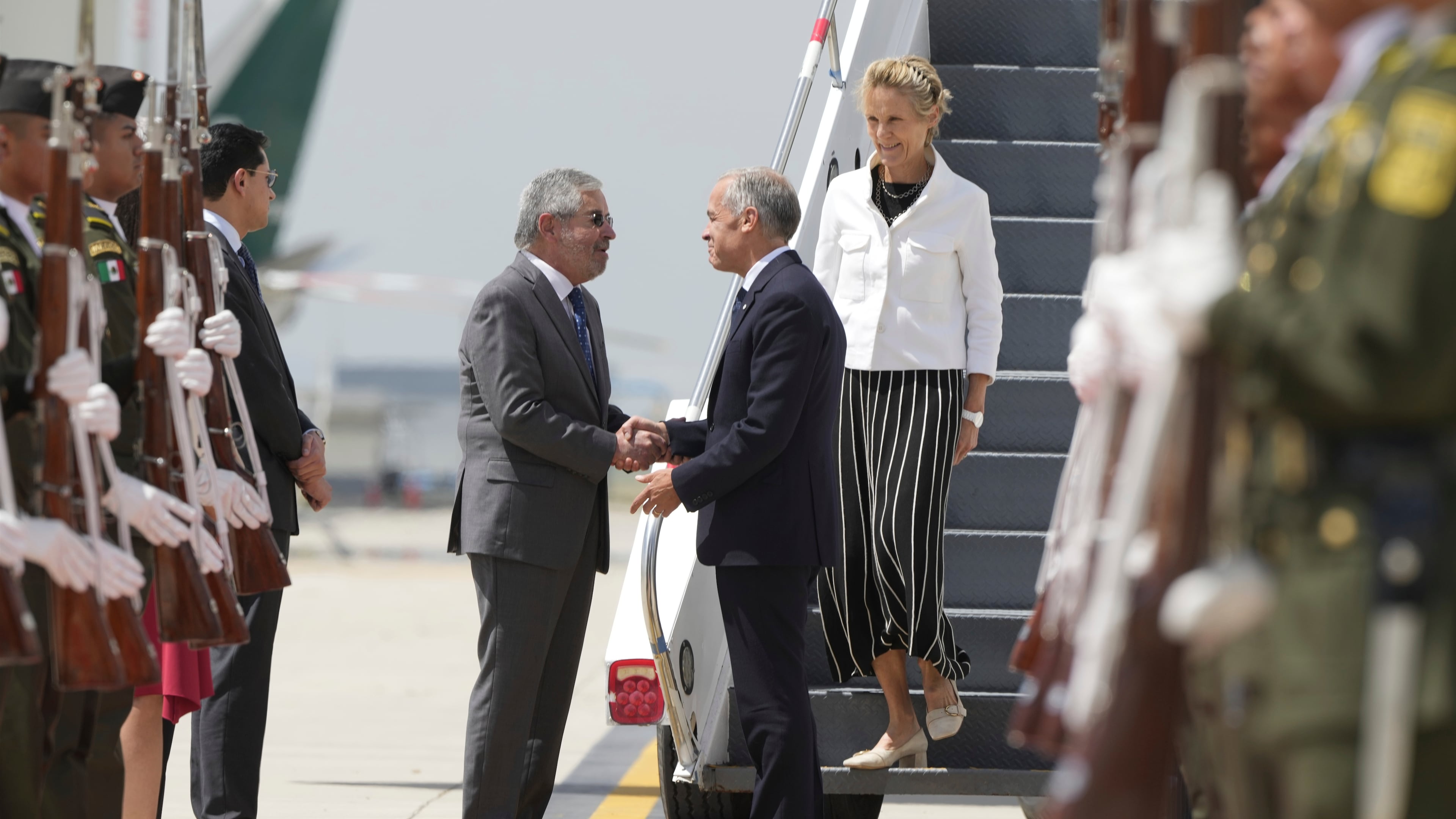 Canada's Prime Minister Mark Carney and his wife Diana Fox Carney are greeted by Mexican Secretary of Foreign Affairs Juan Ramon de la Fuente as they arrive in Mexico City, Thursday, Sept. 18, 2025. (Adrian Wyld/The Canadian Press via AP)