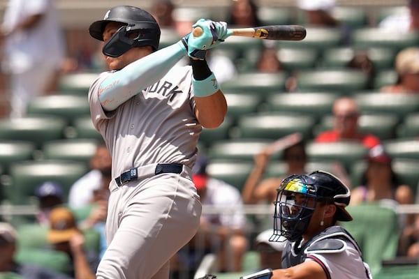New York Yankees' Aaron Judge (99) hits a solo home run against the Atlanta Braves in the first inning of a baseball game, Sunday, July 20, 2025, in Atlanta. (AP Photo/Mike Stewart)