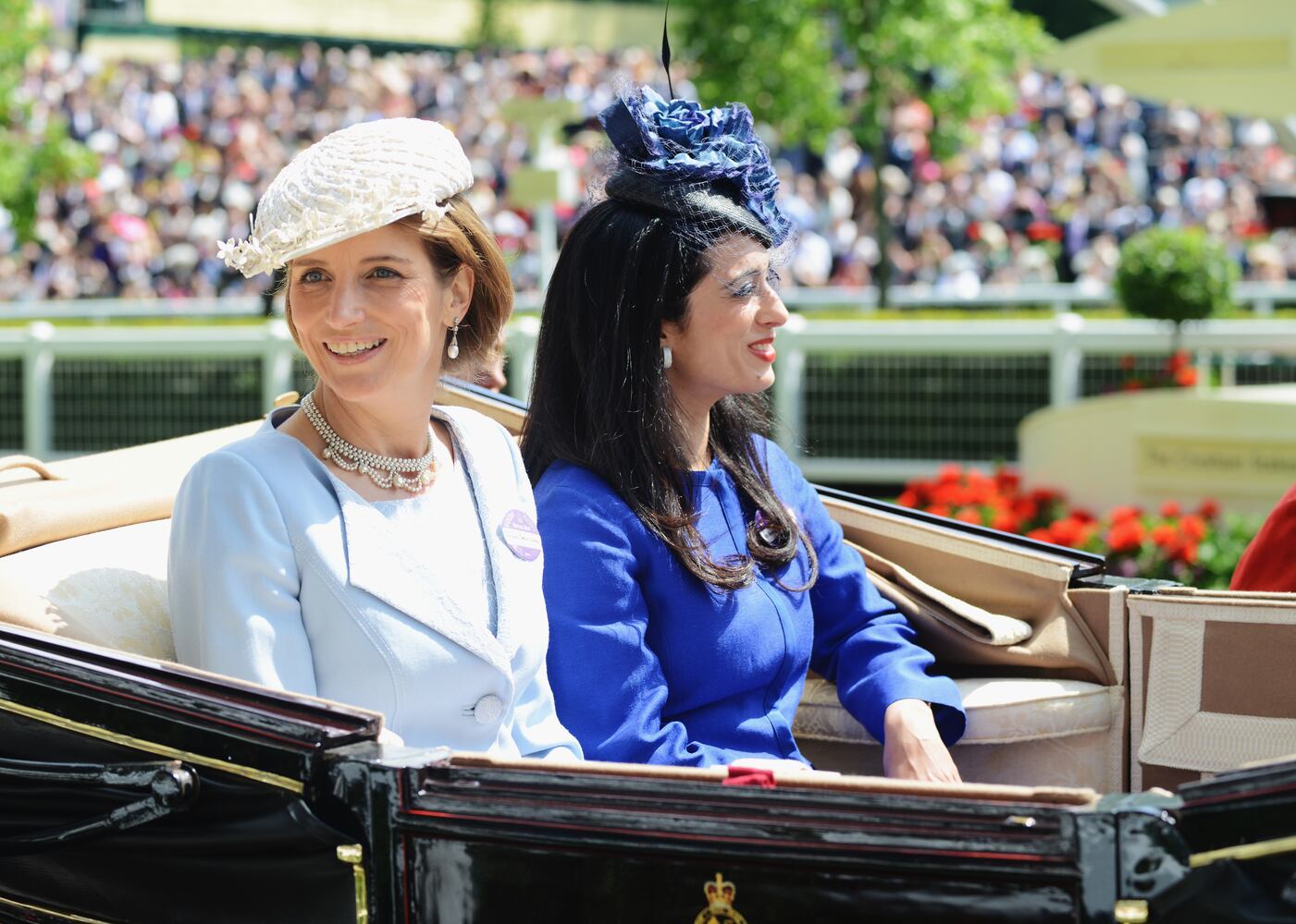 Race goers show hat styles