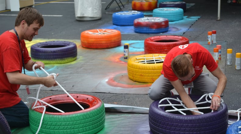 LexisNexis employees build chairs for a recreation room at a Hands on Atlanta partner school. CONTRIBUTED BY TIM ADKINS