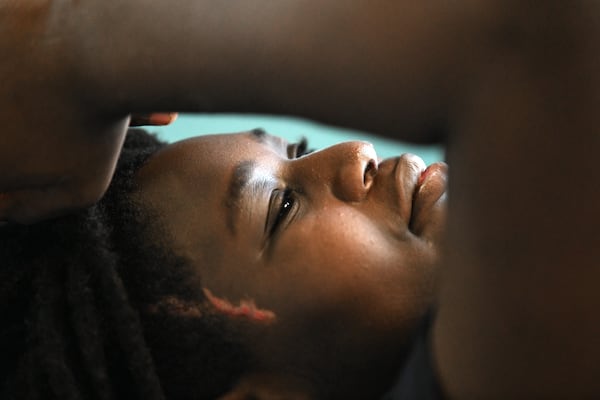 Preston Veal, 12, receives his first physical therapy since he was struck by a cargo van. The young athlete now has scarring on the right side of his face. (Hyosub Shin/AJC)