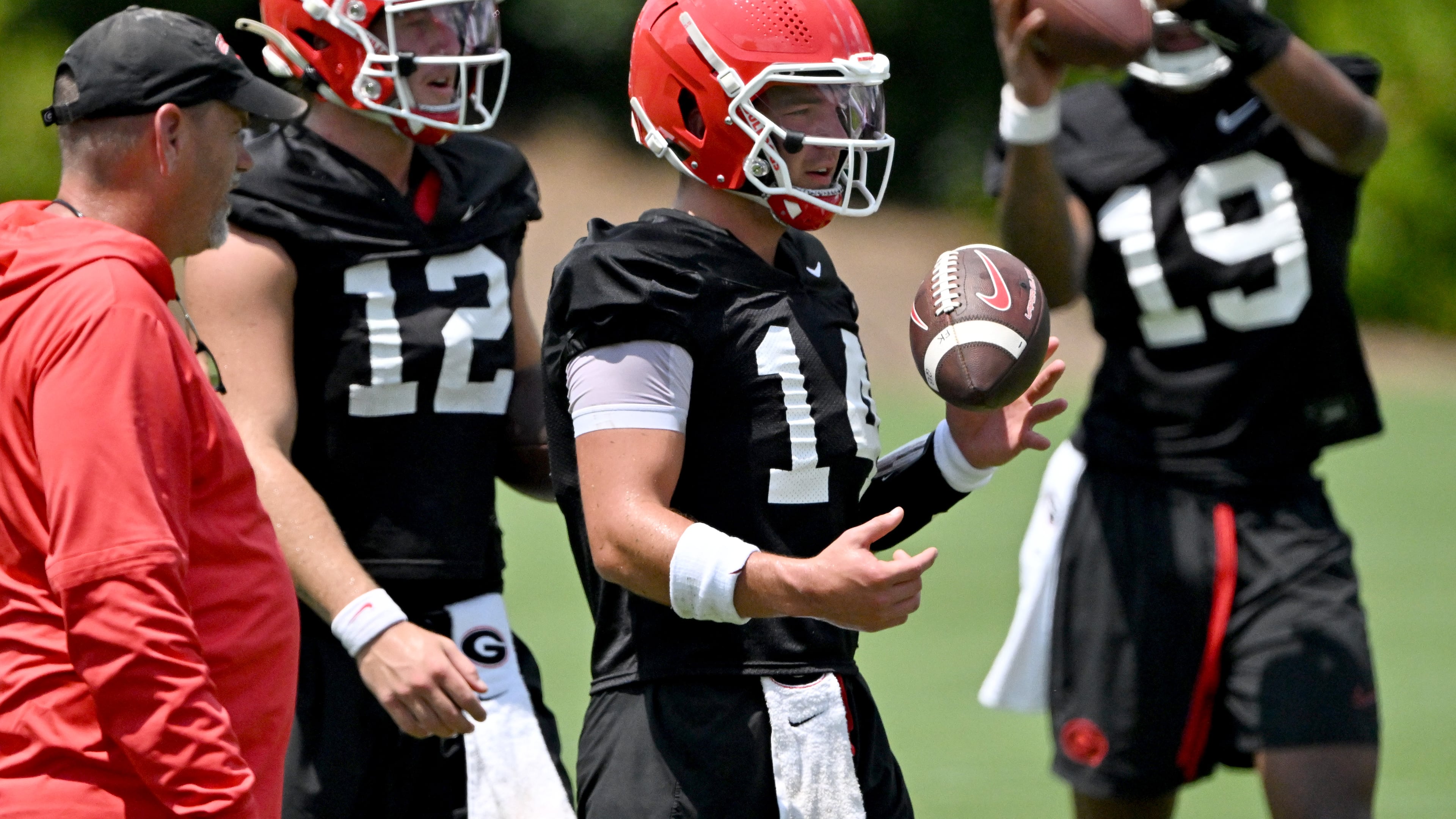 Georgia quarterback Gunner Stockton and other players participate in a football practice at the University of Georgia practice facility, Thursday, July 31, 2025, in Athens. (Hyosub Shin/AJC)