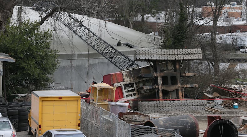 A crane collapsed late Thursday morning at a City of Atlanta sewage pumping station and storage facility under construction off Cheshire Bridge Road.