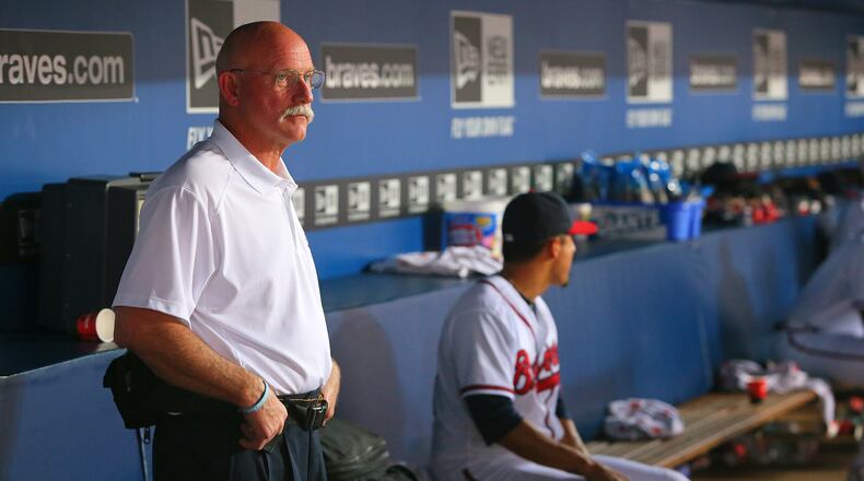 Braves head athletic trainer Jeff Porter watches from the dugout as the Braves play the Pirates on Tuesday, June 4 , 2013, in Atlanta. CURTIS COMPTON / CCOMPTON@AJC.COM