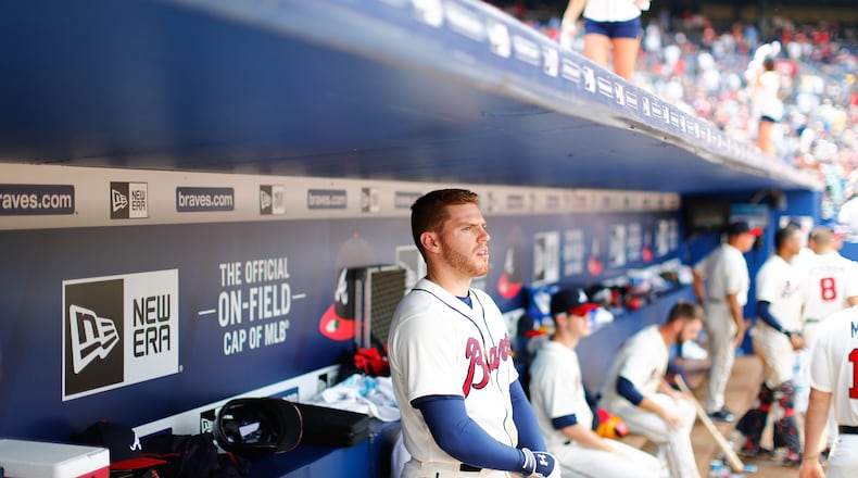 ATLANTA, GA - MAY 3: Freddie Freeman #5 of the Atlanta Braves stands in the dugout during the seventh inning against the Cincinnati Reds at Turner Field on May 3, 2015 in Atlanta, Georgia. Freeman was out of the lineup Sunday, May 31, against the Giants, snapping a string of 217 consecutive games started by the Braves first baseman.(Photo by Kevin Liles/Getty Images)